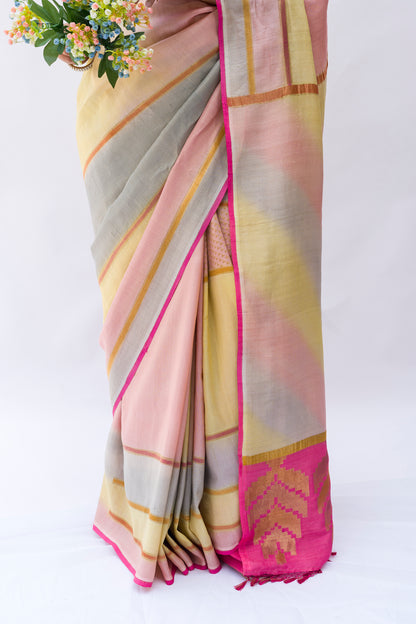 Woman wearing a multicolored Banarasi saree in soft tusser silk with pink palla
