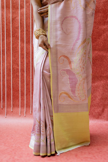 Close-up view of a luxury Banarasi saree featuring floral motifs paired with elegant gold jewelry