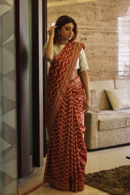 Timeless red Banarasi drape, showcasing traditional craftsmanship and festive elegance.