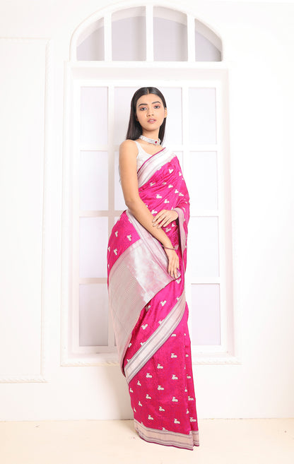A graceful pink Banarasi saree that blends luxury with tradition.