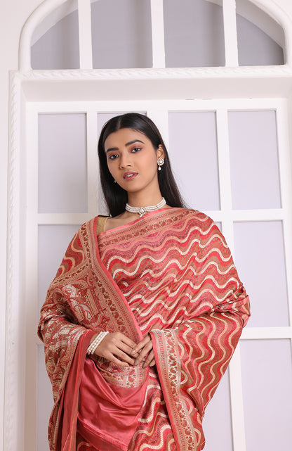 A graceful red Banarasi saree that radiates sophistication and cultural charm.