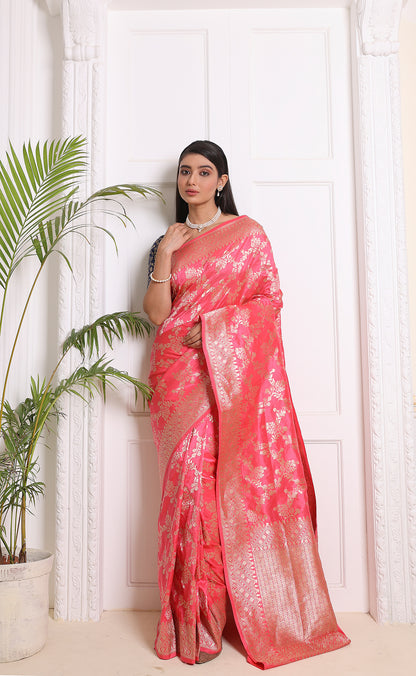 A graceful light pink Banarasi saree that radiates sophistication and cultural charm.