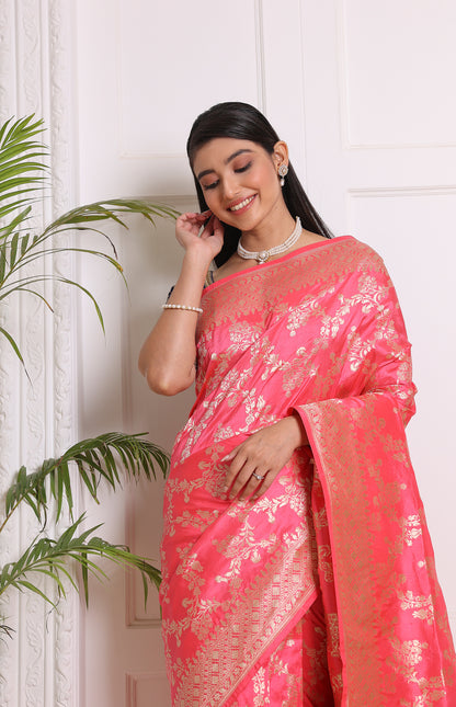 A delicate light pink Banarasi saree woven with intricate traditional motifs for timeless elegance.