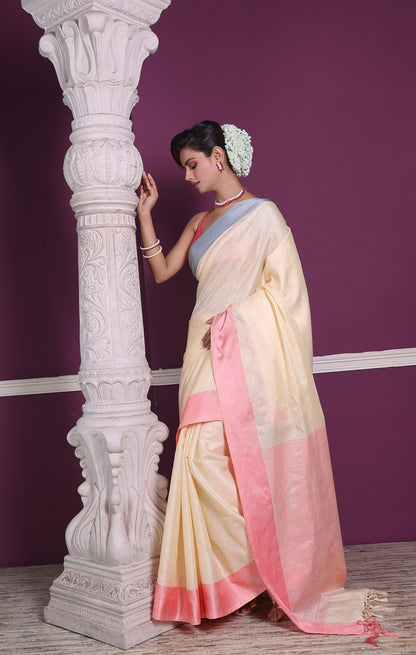 Pastel lemon yellow–pink soft silk saree inspired by Banarasi weaving heritage