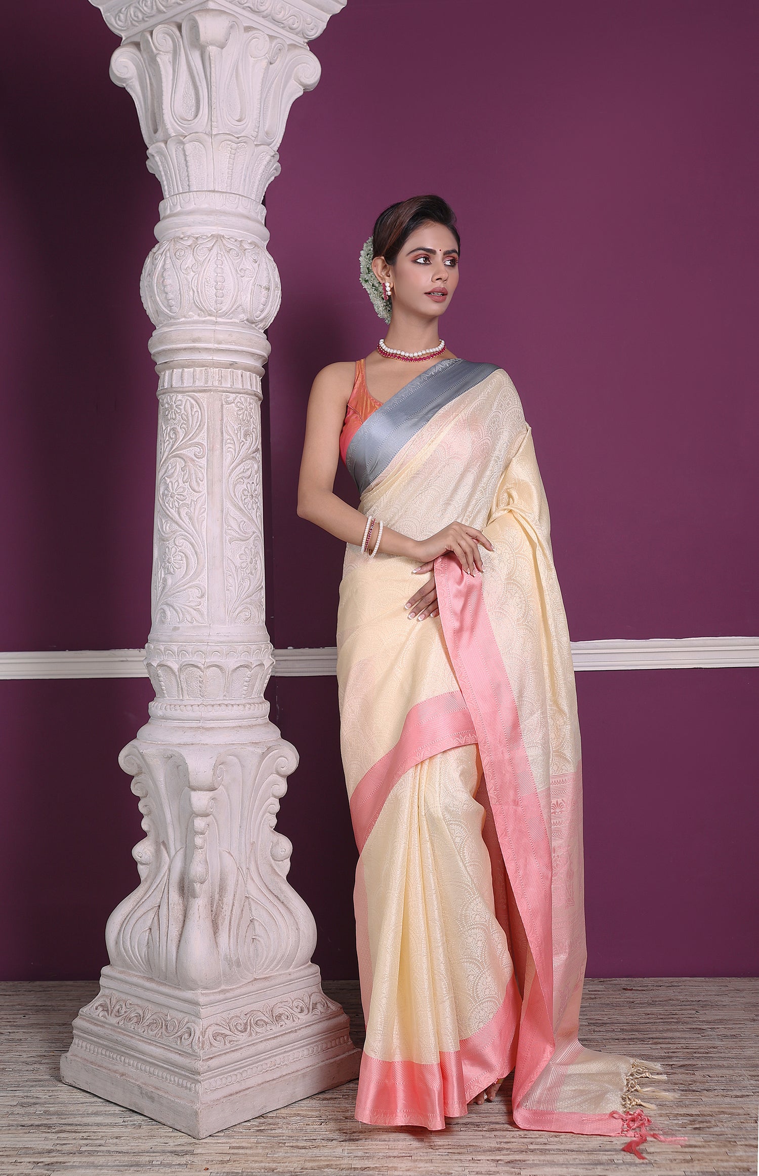 Lemon yellow and pink soft silk Banarasi saree with traditional handloom weaving